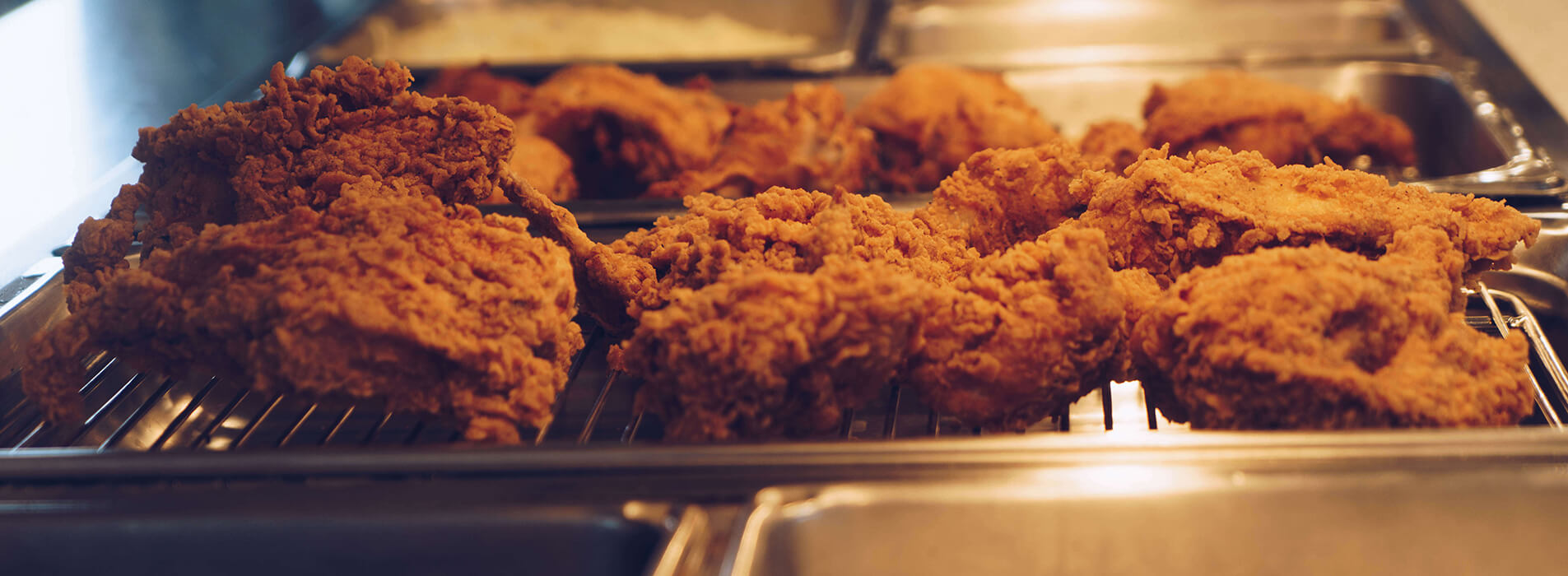 Fried chicken on a heated tray